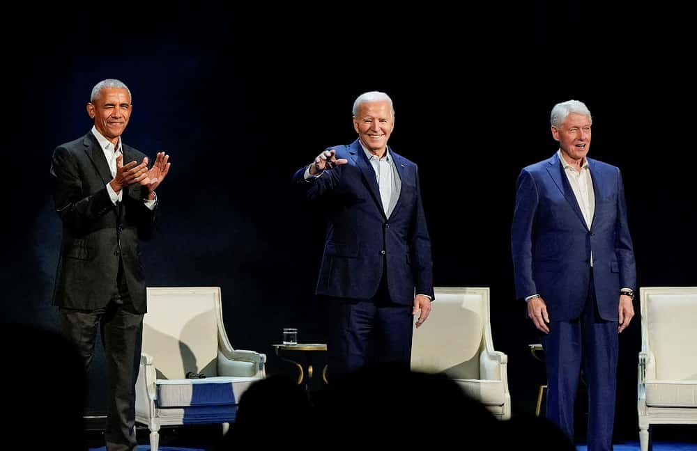 Barack Obama, Joe Biden y Bill Clinton, durante el acto.